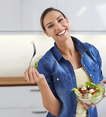 Image showing Happy woman, portrait and kitchen with bowl of salad for natural nutrition, healthy eating or diet at home. Face of female person or vegetarian with smile for vegetables, vitamins or fiber at house