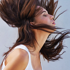 Image showing Woman, hair or wind as haircare, hairdressing or keratin as healthy, texture or growth for scalp. Long, natural or hairstyle as grooming for maintennce, shine or volume in studio on white background