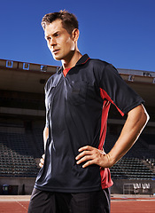 Image showing Man, fitness and confident soccer player in stadium, athlete and competitive for match or game. Male person, serious face and determined for competition, outdoors and focus for football challenge