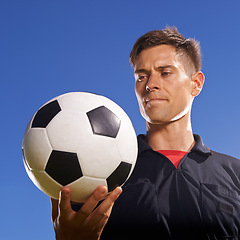 Image showing Face, soccer and ball with man on blue sky background as referee for competition, game or match. Fitness, football and sports with serious person outdoor for beginning or start of tournament