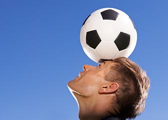 Image showing Football, bounce and head with man, sports and training with competition and exercise. Person, blue sky and player with practice for a game or athlete with skills and technique with fitness or soccer