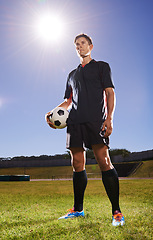 Image showing Man, field and training with soccer ball for workout or practice for game with fitness and tournament in Belgium. Male person, player and exercise for sport or football career with warm up for match