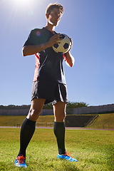 Image showing Man, fitness and confident soccer player on field, athlete and competitive for match or game. Male person, serious and determined for competition, outdoors and ready for football challenge or sports