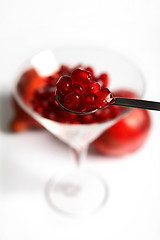 Image showing Pomegranate seeds on a spoon