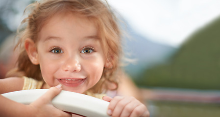 Image showing Portrait, smile and child outdoor in summer on holiday, vacation and adorable little girl travel alone in Switzerland for trip. Face, happy and cute kid in nature for journey, adventure and childhood