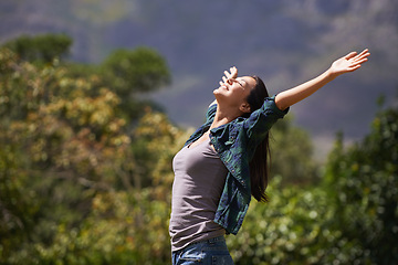 Image showing Freedom, joy and relax for woman in outdoor, garden or forest for bliss, satisfaction and fulfillment. Young person, smile with arm in air for optimism, happiness and excited in environment on mockup
