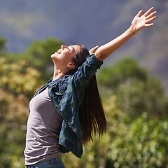 Image showing Freedom, peace and hands raised with young woman in garden of spring for enthusiasm or inspiration. Nature, smile and wellness with happy person outdoor at park in summer for energy or excitement