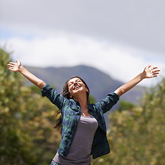 Image showing Freedom, smile and hands raised with young woman in garden of home for enthusiasm or inspiration. Nature, relax and wellness with happy person outdoor at park in summer for energy or excitement