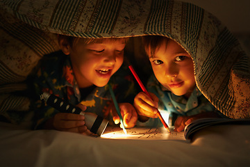 Image showing Blanket, flashlight and children at night with happiness in portrait with drawing in a book. Friends, relax and sketch on notebook in dark with light under duvet at sleepover with a pillow tent