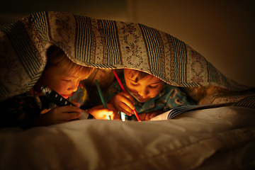 Image showing Blanket, flashlight and children at night with happiness and drawing in a book with a torch. Friends, relax and sketch on notebook in dark with light under duvet at sleepover with a pillow tent