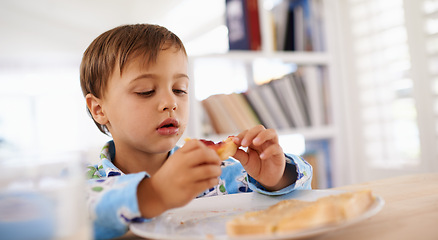 Image showing Food, breakfast and boy eating for nutrition, toast and home dinning room in morning. Pyjamas, children and hungry with bread for health and development, jam and snack or wellness for toddler