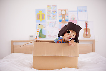 Image showing Home, telescope or costume as pirate to play in boat boxes or fantasy in bedroom or house. Kid hiding, child captain or boy in an adventure game with cardboard or creative monocular to sail on ship