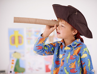 Image showing House, telescope or costume as pirate to play in fantasy in his bedroom with vision toy or creativity. Kid sailor, child captain or young boy in a game with pyjamas, hat or monocular to sail on bed