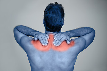 Image showing Studio, man and hands for shoulder pain or tension with muscle inflammation, discomfort and sprain of stress or strain. Red glow, back view and person with ache, injury and bruise on grey background
