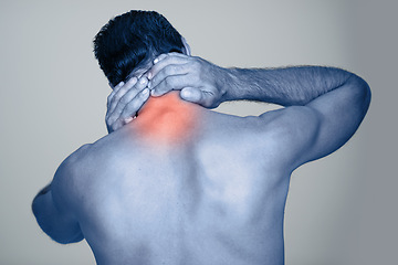 Image showing Back pain, injury and body strain from fitness or exercise, stretch and gray background. Tension, hands or joint or muscle on spine for male model, studio and medical from accident with rear view