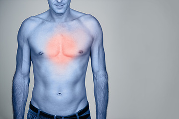 Image showing Medical, chest pain and man with heartburn in studio with inflammation, discomfort or injury. Red glow, shirtless and person with healthcare emergency, ache or strain by gray background with mockup.