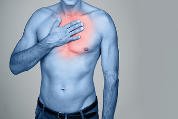 Image showing Medical, chest pain and man with inflammation in studio with heartburn, discomfort or injury. Red glow, shirtless and person with healthcare emergency, ache or strain by gray background with mockup.