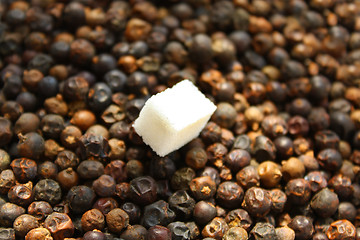 Image showing Sugar and dried juniper berries