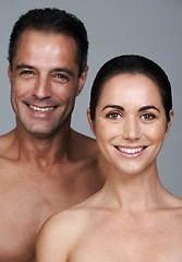 Image showing Couple, portrait and skincare in studio, beauty and collagen cosmetics for anti aging. Mature people, facial treatment and dermatology for health on gray background, smile and together for wellness