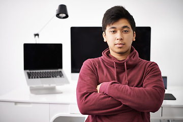 Image showing Laptop, portrait and man on software for update in office with information technology for cybersecurity. Coder, programmer and male person with arms crossed in workplace with monitor of computer