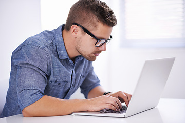 Image showing University, elearning and man with laptop for research, study and typing for education, knowledge and opportunity. Computer, reading and college student writing report for online course with glasses.