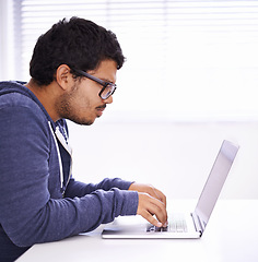 Image showing Elearning, typing and man with laptop for research, study or university for education, knowledge and opportunity. Computer, reading and college student writing report for online course with glasses.