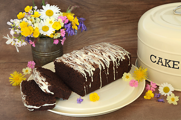 Image showing Sliced Chocolate Chip Cake with Spring Flowers