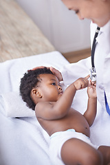 Image showing Baby, pediatrician and healthcare consultation with stethoscope as childhood development, examination or ill. Patient, kid and doctor support on hospital bed in Kenya for diagnosis, flu or wellness