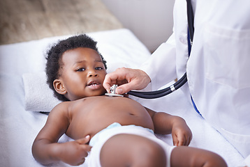 Image showing Baby, portrait and pediatrician with stethoscope for heartbeat consultation or lung infection, listening or checkup. Child, boy and face on hospital bed or healthcare wellness in Kenya, clinic or ill