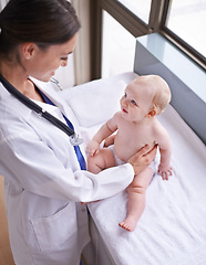 Image showing Healthcare, pediatrician and woman with baby, boy and checkup with wellness and doctor in a clinic. Medical, cheerful professional or employee with smile and happy infant with appointment or medicare