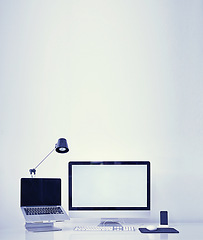 Image showing Computer, technology and workspace with mockup screen of equipment or interior on a gray studio background. Empty room with laptop, pc or desktop display of workstation, tools or tech for design