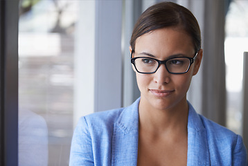 Image showing Professional, woman and thinking at window with ideas for future strategy in business as financial advisor. Planning, decision and person in corporate office problem solving with serious confidence