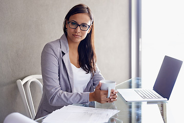 Image showing Coffee, laptop and portrait of business woman in office with confident and pride attitude. Technology, serious and professional female financial advisor with computer for finance project in workplace