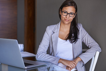 Image showing Portrait and laptop for businesswoman in office, and desk for professional person. Face, happy and technology for attorney lawyer in workplace, eyewear and computer for legal research for case