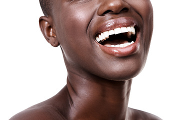 Image showing Mouth of black woman, happy or laughing with beauty, cosmetics or healthy skin for shine in studio. Funny, closeup or African girl model with lip gloss, smile or skincare results on white background