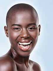 Image showing Portrait, beauty and skincare with bald black woman in studio on blue background for natural wellness. Face, smile and aesthetic with happy young model at spa for cosmetics, facial or dermatology