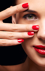 Image showing Portrait, red lips and half face of woman in studio with makeup, trendy and beauty routine. Nail polish, hand and female person with facial cosmetics treatment and manicure by black background.