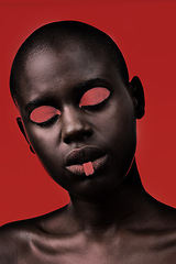 Image showing Black woman, makeup and aesthetic with beauty, skin and creative with studio and color. Model, closeup and face paint for artistic, contrast and cosmetics for glamour isolated on red background