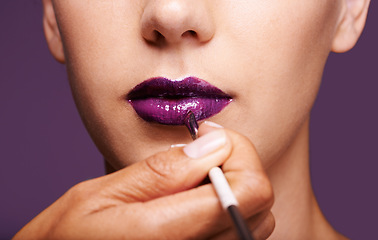 Image showing Lipstick, beauty and mouth of woman on purple background for makeup, cosmetics and products. Salon aesthetic, creative and closeup of lips of person with lipgloss, shine and cosmetics in studio