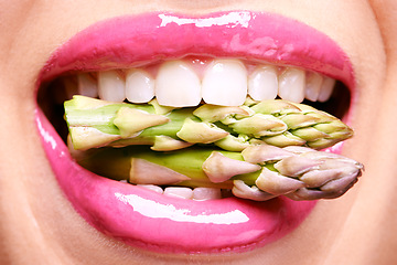 Image showing Woman, lipstick and closeup of vegetables in mouth for beauty, nutrition and healthy with vegan cosmetic product. Cruelty free makeup, cosmetology and asparagus, pink lip gloss for aesthetic or art