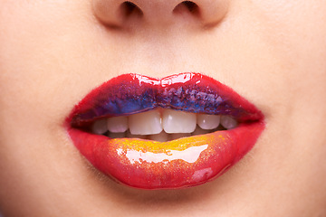 Image showing Lipstick, creative makeup and mouth of woman for luxury, wellness and products with colors. Salon aesthetic, cosmetology and closeup of lips of person with lip gloss, shine and cosmetics in studio
