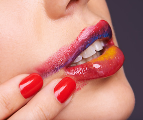 Image showing Lipstick, smear and woman for beauty with hand, makeup and red nail polish with cosmetic product in studio. Face, smudge on skin and color for cosmetology with manicure, creativity and glamour