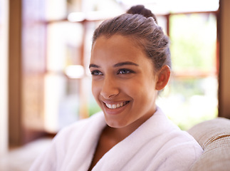 Image showing Spa, thinking and woman with smile, relax and vacation with getaway trip and adventure. Person, hospitality and girl with luxury and bathrobe with wellness and skincare with holiday, peace and hotel