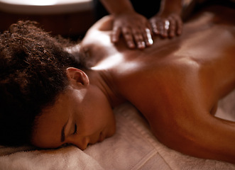 Image showing Massage, relax and wellness with black woman at spa on bed or table for luxury pamper treatment. Beauty, peace and therapy with back of young customer at resort or salon for holistic healing closeup