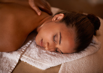 Image showing Face, massage and relax with woman at spa as customer for luxury pamper treatment or wellness. Beauty, peace and skincare with back of young person on bed or table at salon for natural stress relief