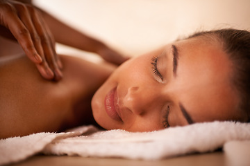 Image showing Hands, woman and wellness at spa for massage, health and skin care for luxury, physical therapy and peace. Female person, happy and relaxed for back, body and wellbeing on table, calm or natural