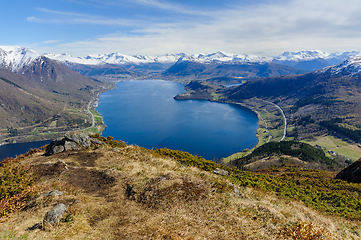 Image showing Majestic highland vista: panoramic view over a serene fjord surr