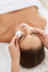 Image showing Woman, pad and facial massage for cosmetics treatment to relax, cleaning and beauty therapy for skin care. Female person, calm and serene or dermatology, closeup and rest at hotel and peace or zen