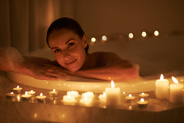 Image showing Woman, portrait and bath with candles or calm cleaning routine with bubbles for treatment, hygiene or wellness. Female person, face and stress relief skincare with spa peace, self care or apartment