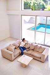 Image showing Home, thinking and woman on couch with laptop for remote work, internet search and relax. Computer, online career or freelance girl on luxury sofa checking social media in living room with high angle